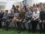 La Defensora Nacional (S), Viviana Castel, sentada al lado derecho del general director de Carabineros, Gustavo González Jure.